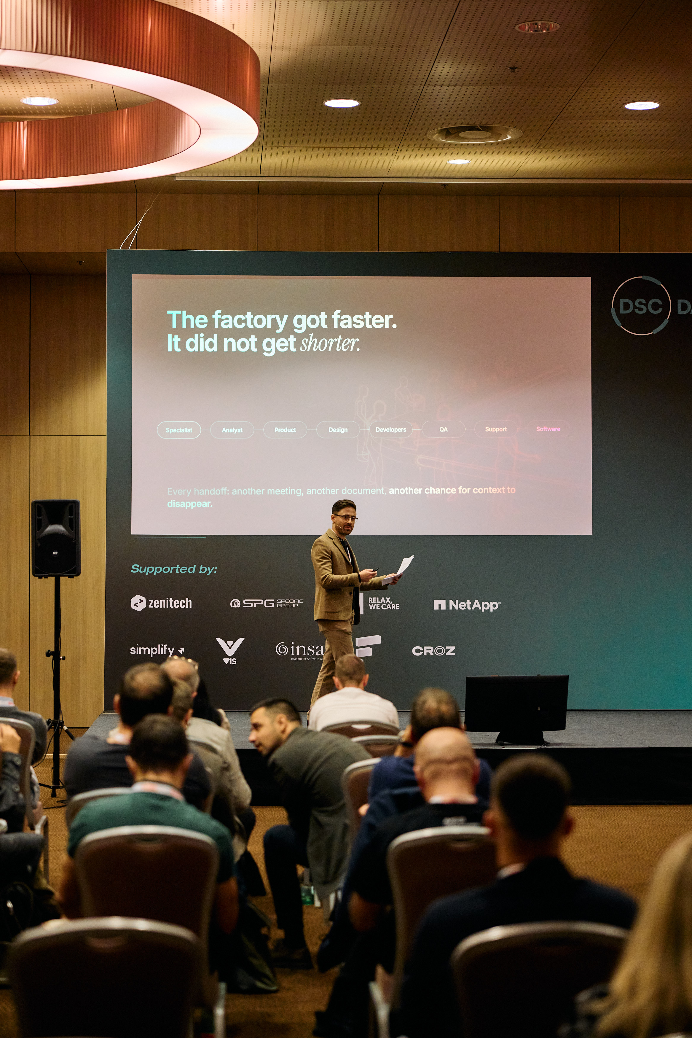 Daniil Aizenshtat speaking at DSC DACH in Vienna, seen from the audience